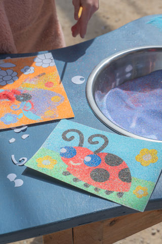 Colourful bug themed sand art at the Cotswold Farm Park May Half Term event for families